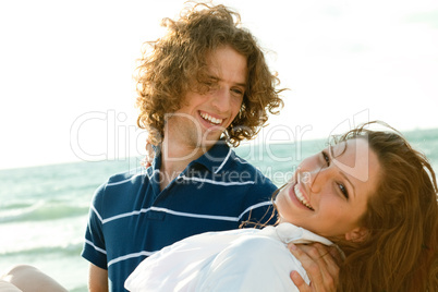 Attractive guy carrying woman