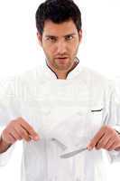 male chef posing with fork and knife
