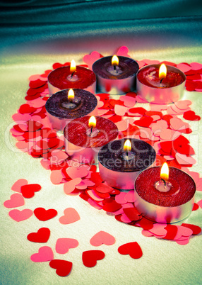 Burning candles heart shaped