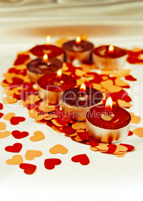 Burning candles heart shaped