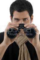 young man holding binocular