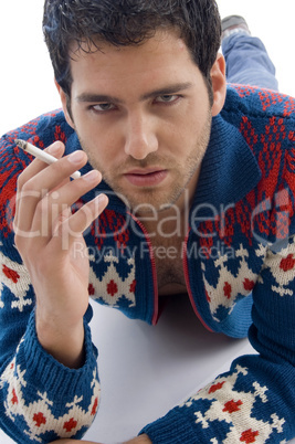 laying male holding cigarette