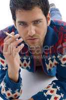 laying male holding cigarette