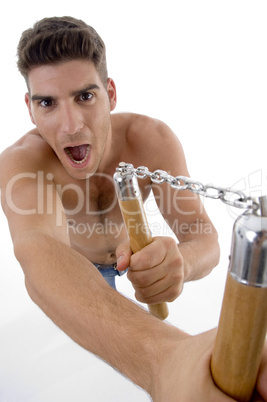 shouting man holding nunchaku