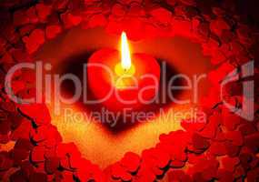 Burning heart shaped candle