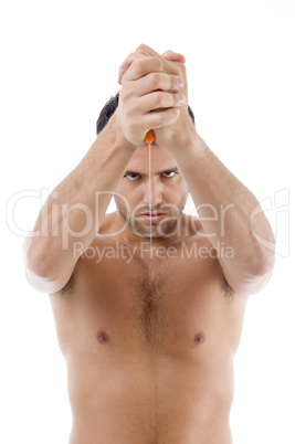 muscular man posing with dagger