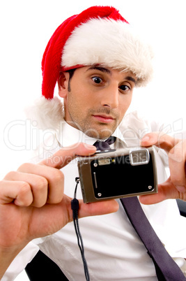 young photographer holding digital camera