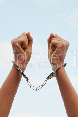 Handcuffed woman's hands