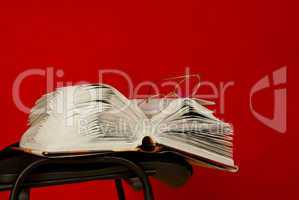 Open book laying on the chair