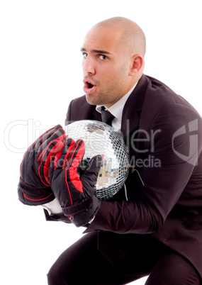 bald male holding disco mirror ball