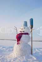 Lonely snowman at a snowy field