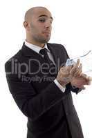 young corporate man wiping off his spectacles