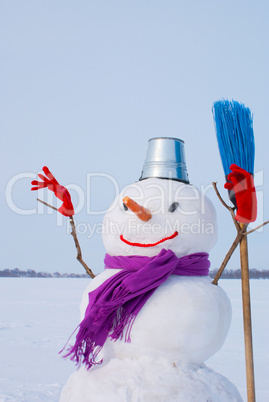 Lonely snowman at a snowy field