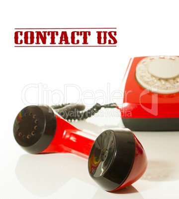 Red old fashioned telephone - Contact us concept