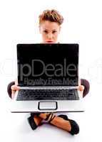 sitting woman showing laptop