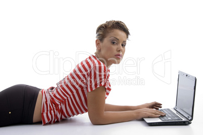 laying female with laptop