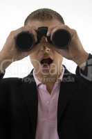businessman looking into binocular