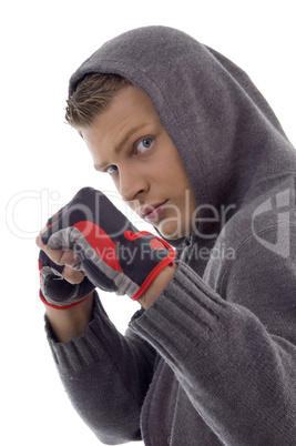 young handsome guy showing fists
