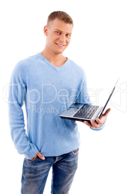 smiling young man with laptop looking at camera