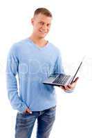 smiling young man with laptop looking at camera