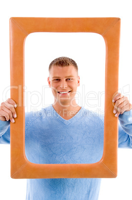 smiling adult man with frame