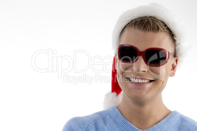 smiling young man with christmas wearing sunglasses smiling young man with christmas wearing sunglasses