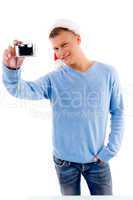 adult guy posing with christmas hat and camera