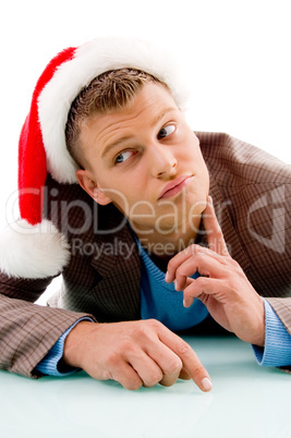thinking young man with christmas hat