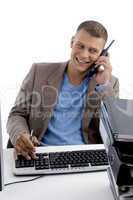 young man talking on phone in office