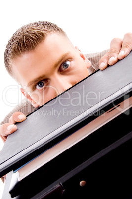 close up of professional man peeping from files