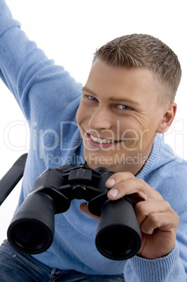 smiling young man with binocular