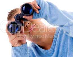 young man looking through binocular