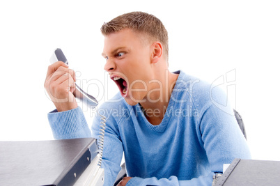 young professional shouting on phone