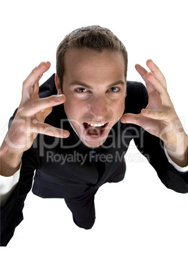 young businessman shouting and looking upside