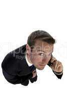 businessman busy on phone call and looking upwards