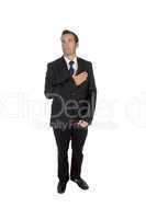 standing businessman saluting by heart