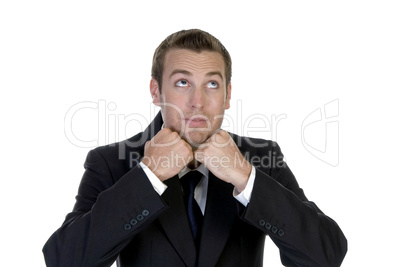 man with clenched hand and looking upside