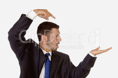 surprised businessman pointing his palm