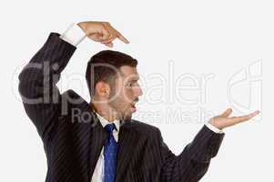 surprised businessman pointing his palm