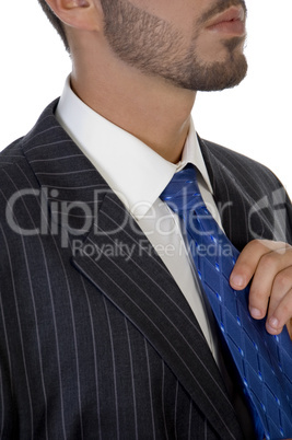executive holding his tie