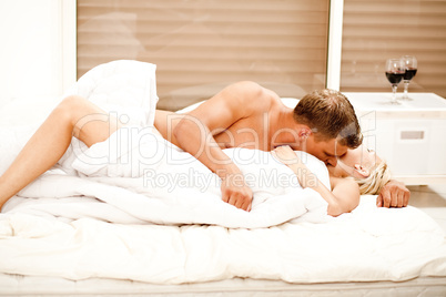 Young married couple kissing