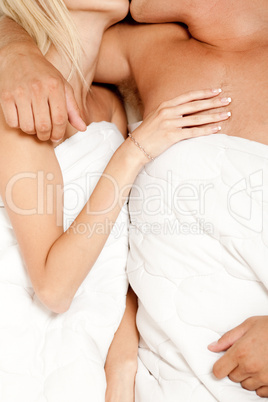 Couple in bed embracing