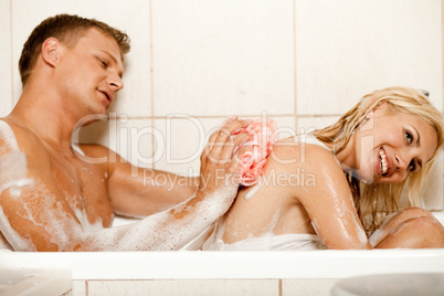 Man bathing his wife