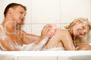 Man bathing his wife
