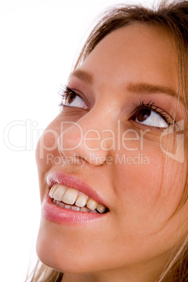 close up of smiling young woman looking aside