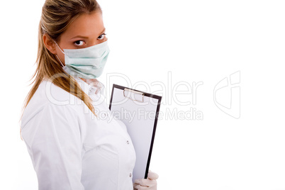 portrait of female doctor carrying writing pad