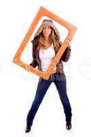 front view of sexy woman holding frame