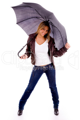 front view of young woman carrying umbrella