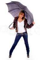 front view of young woman carrying umbrella