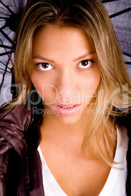 close view of model holding umbrella